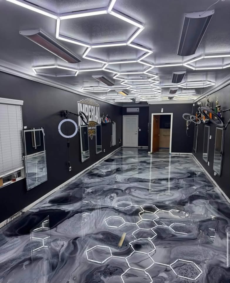 Premium gray metallic epoxy garage floor under hexagon LED ceiling grid – Imperial barbershop